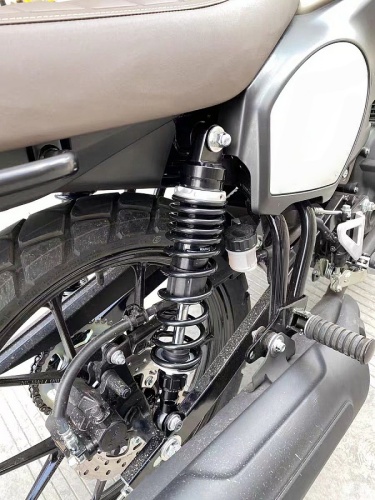 Close-up of RFY piggyback rear shock absorber mounted on motorcycle, optimized for 100kg load